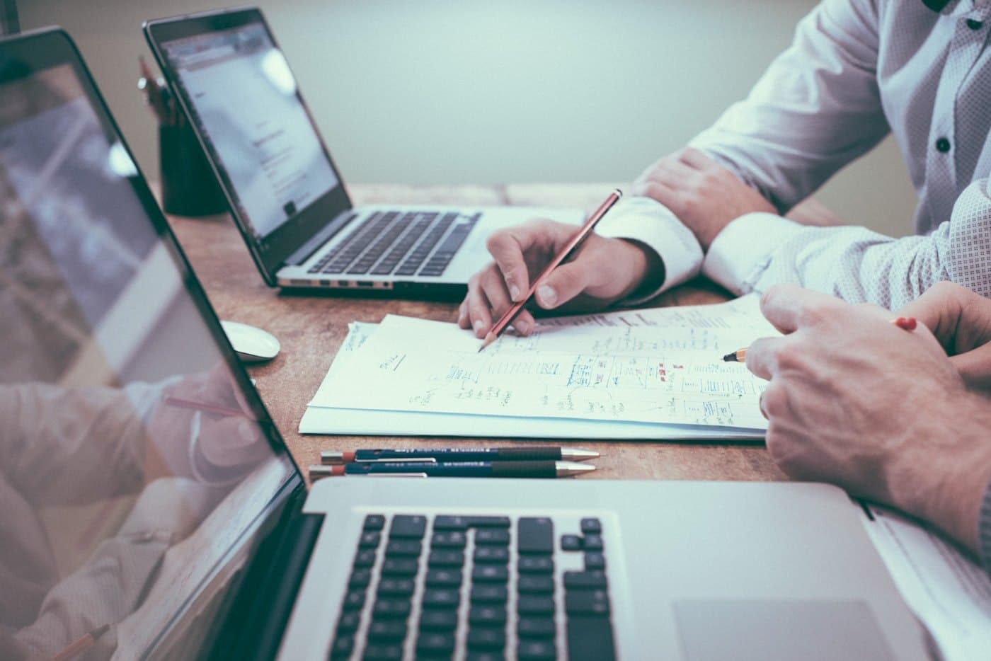 Ledger, invoices, and financial records on a desk